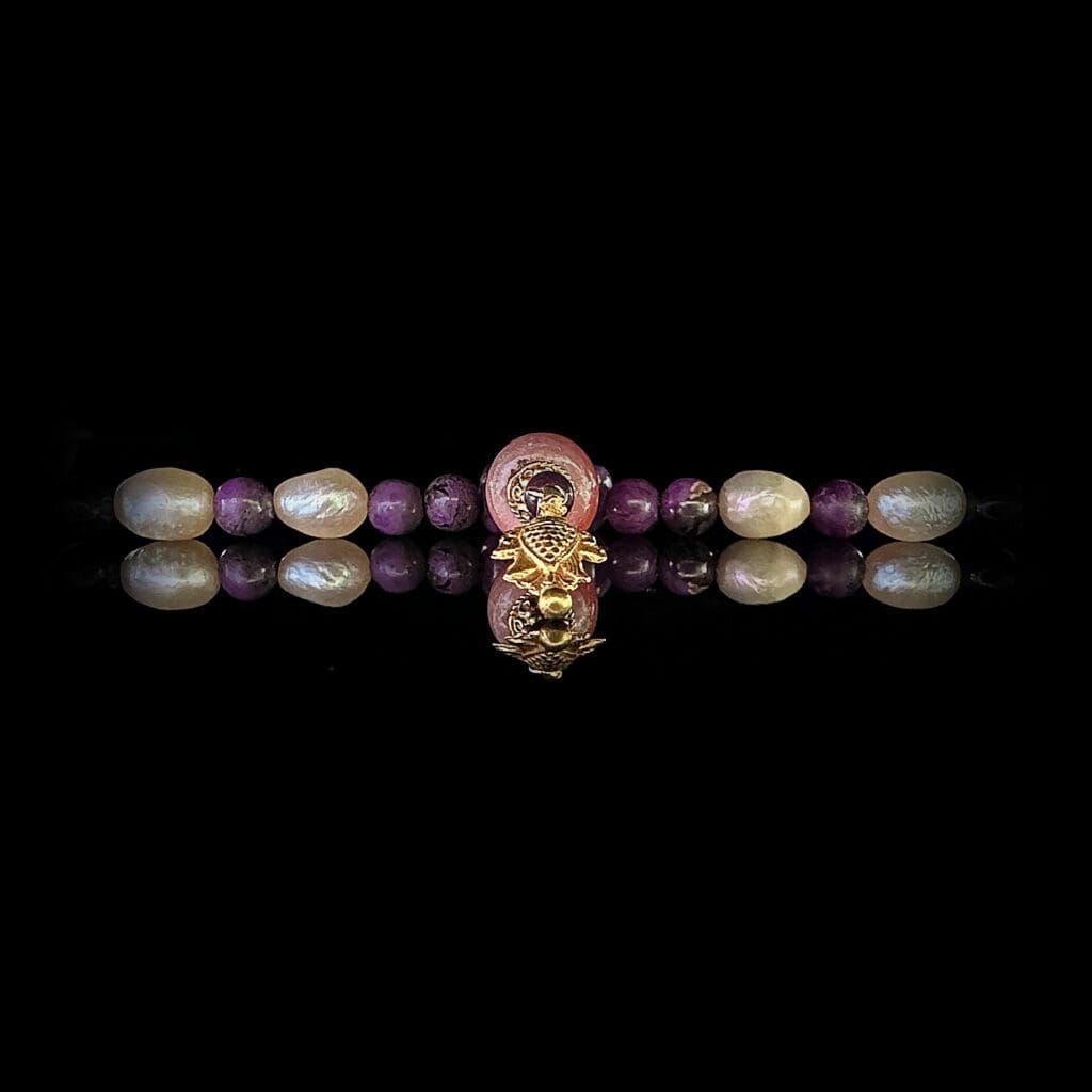 Rhodocrosite, sugilite, pearls and gold