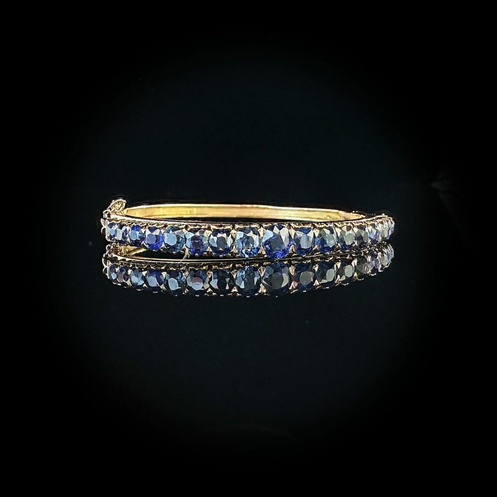 Blue sapphire gold bangle