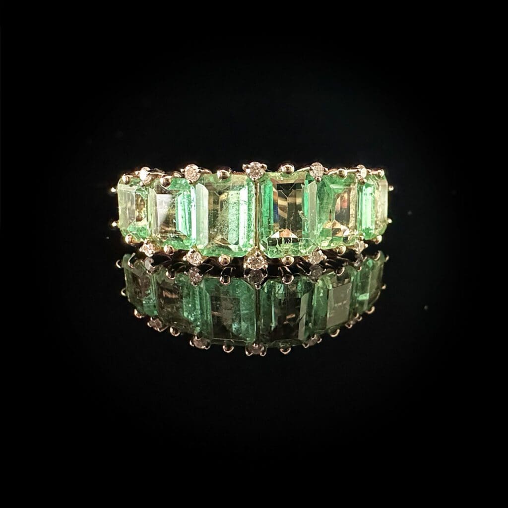 Six emeralds ring