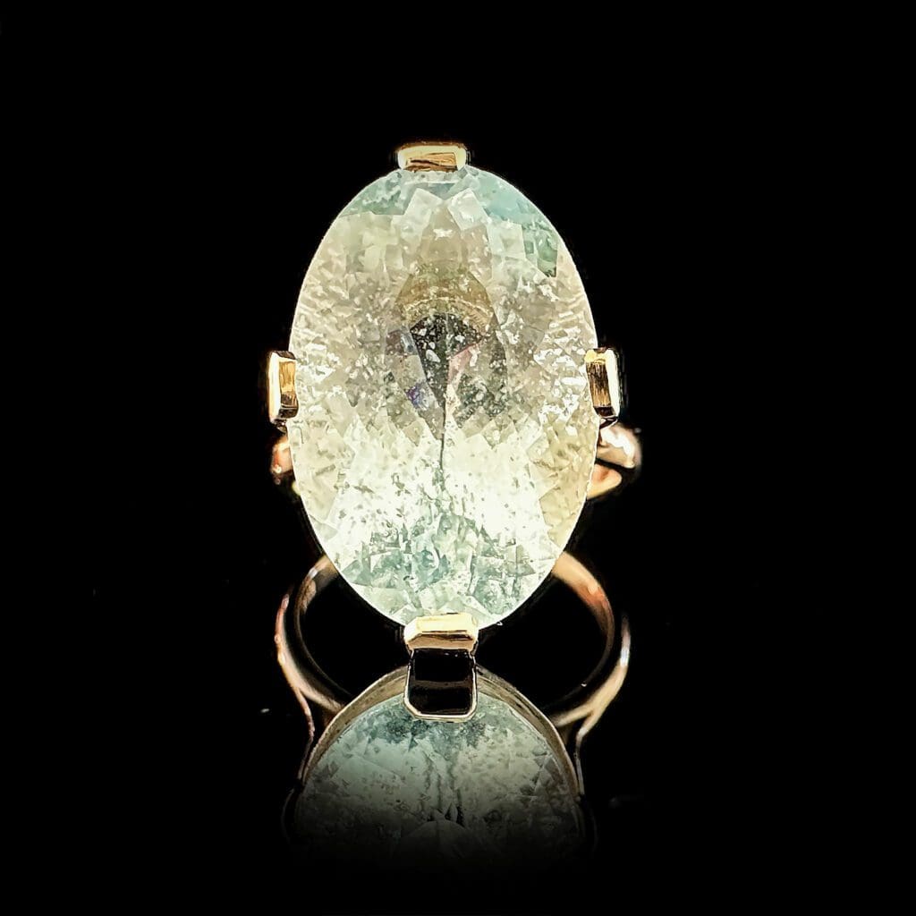Large oval aquamarine yellow gold ring