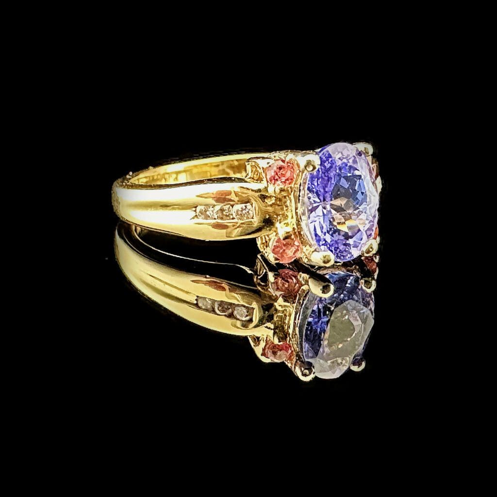 Oval tanzanite, four pink sapphires, diamonds & yellow gold ring - Image 3