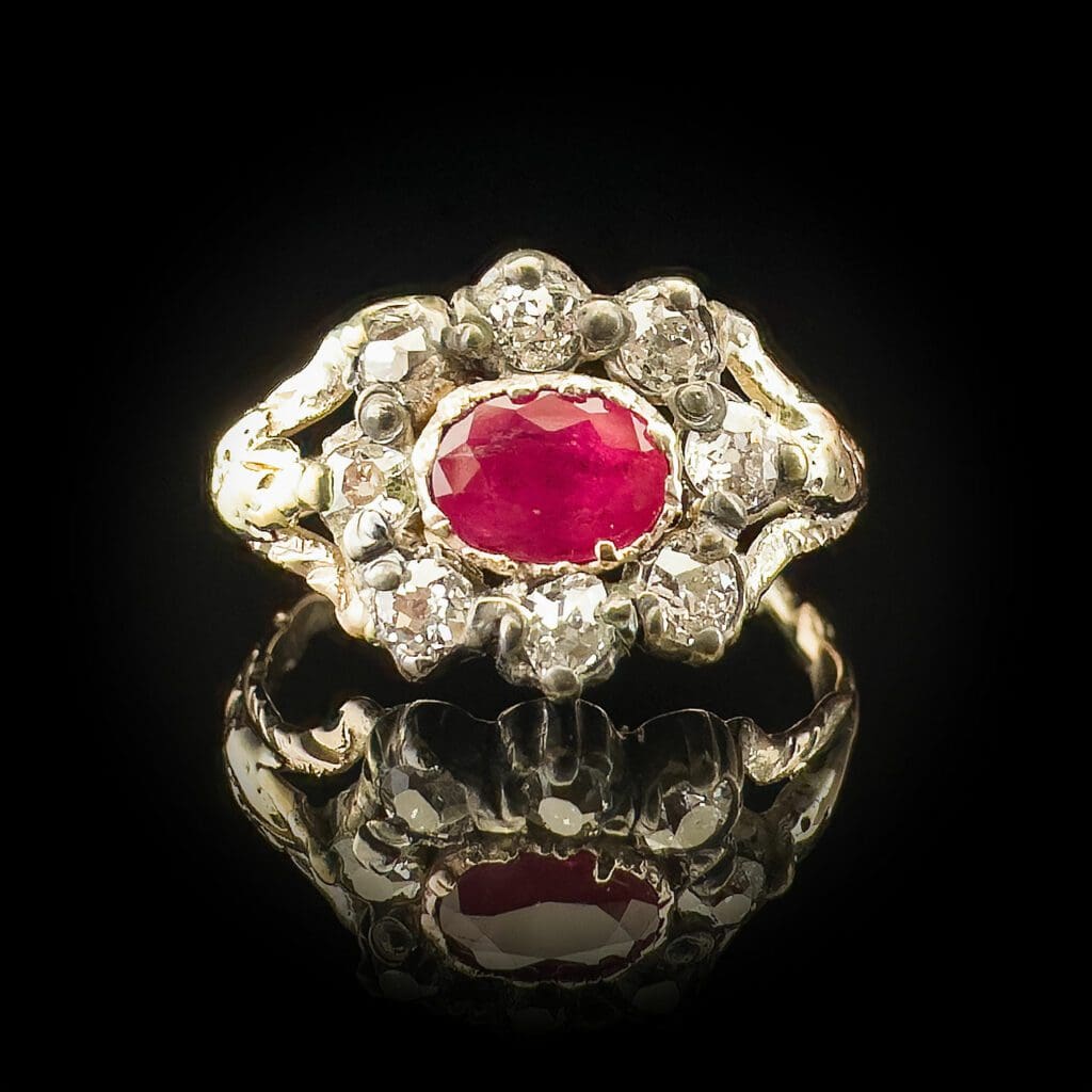 'Georgian Ruby'-Antique oval ruby and 8 diamond cluster