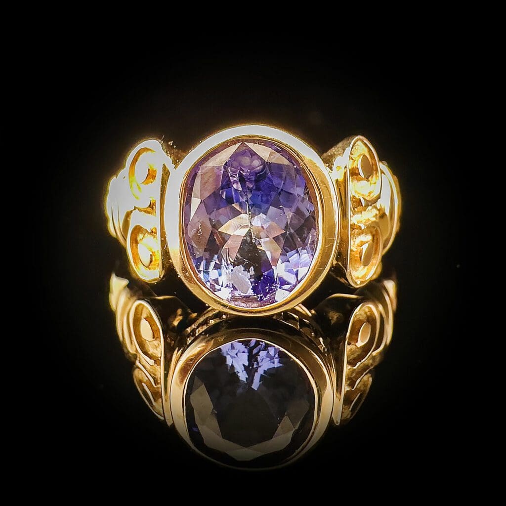 Oval tanzanite yellow gold ring