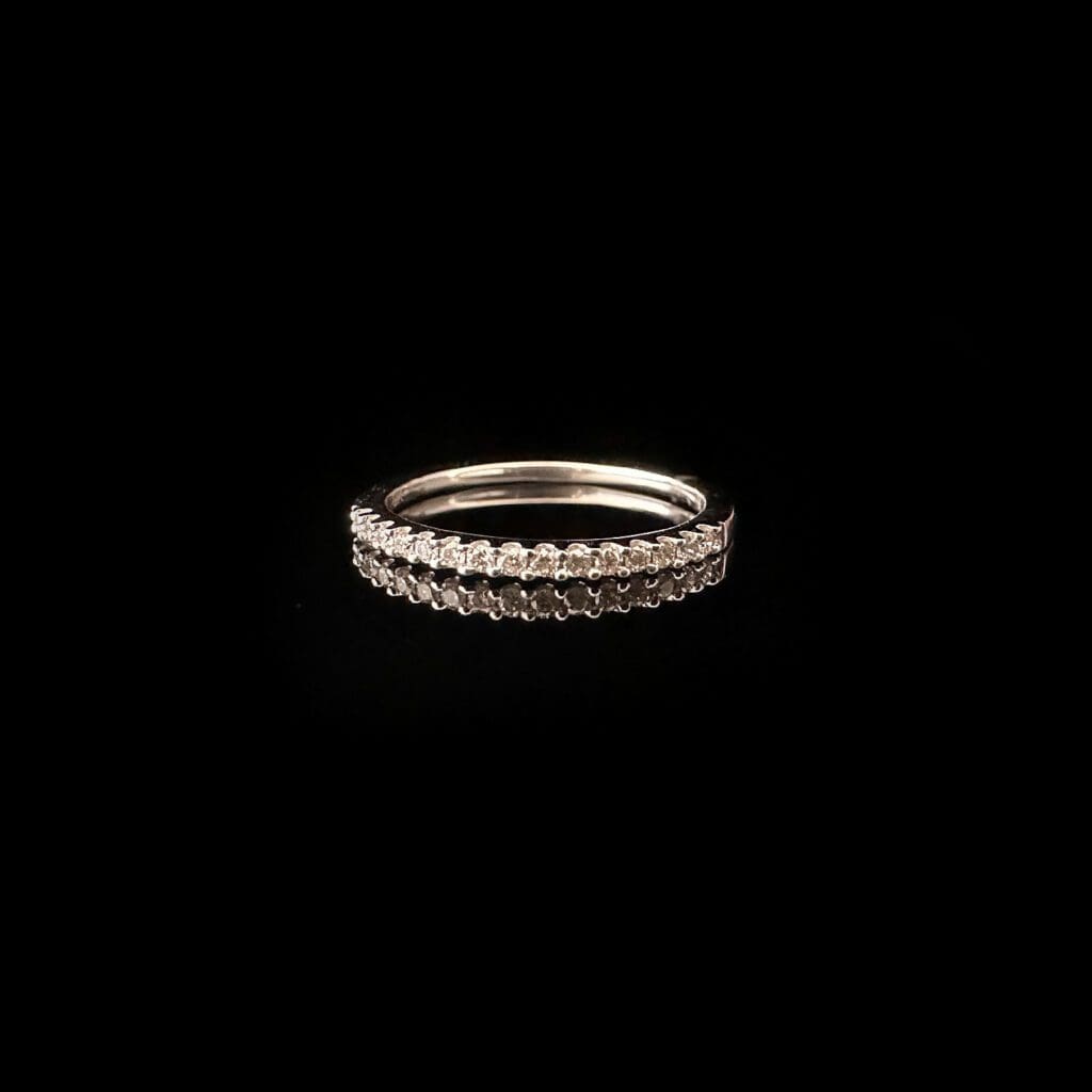 White diamond set white gold band ring