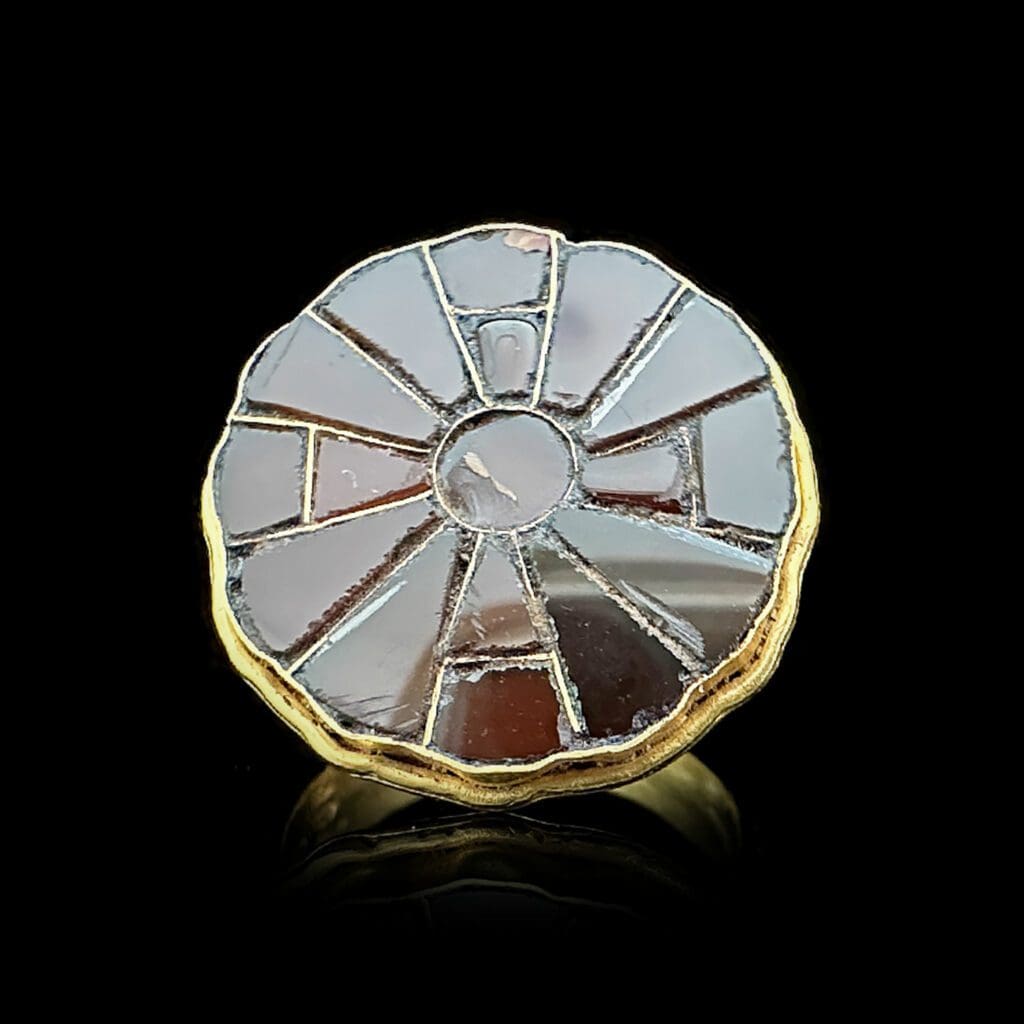 Merovingian gold ring with rosette shaped garnet bezel Circa 500-600AD