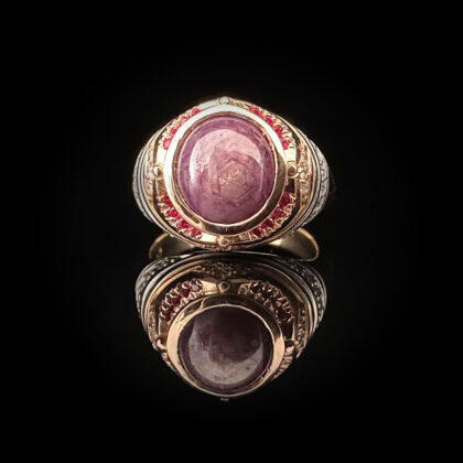 ‘Soraya’-Star ruby cabochon gold ring with rubies and diamonds