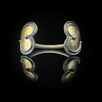 'Two hearts unite'-Antique Viking Era silver bracelet with two heart shaped gilt finials