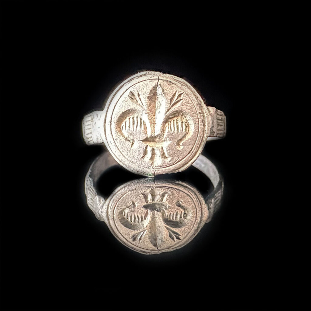 Home 13 ‘Fleur de Lys’- Medieval Silver Ring with Fleur-de-Lys Ca. 1200-1300 AD